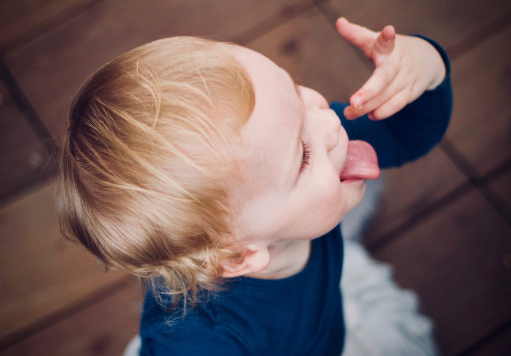 God gave us 5 senses:  Child tasting