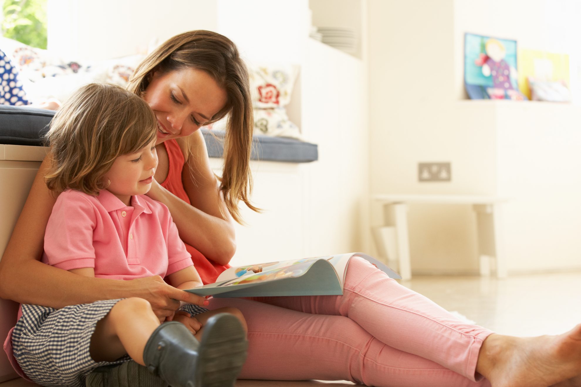Mother Sitting With worried Son Reading Story