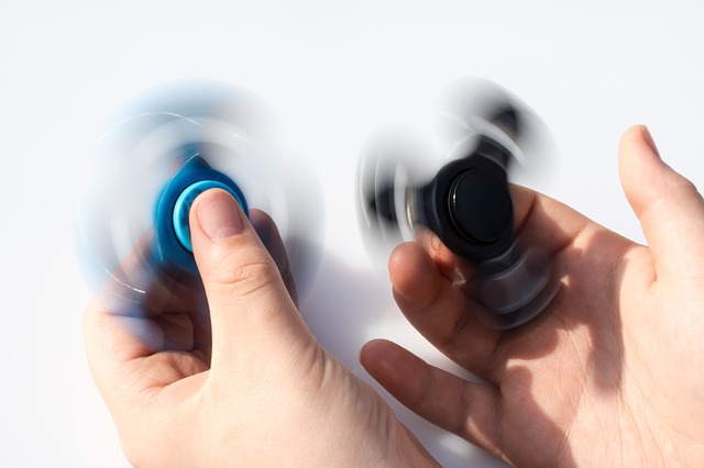 fidget spinners, illustrating the love dance of the Trinity